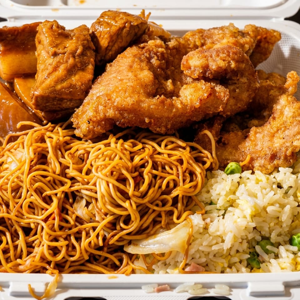 Takeout container filled with fried chicken, chow mein noodles, fried rice, and glazed barbecue pork.